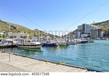 Balaklava, Sevastopol, Crimea, Russia-june 02, 2018: Boats And Boats Moored To The Shore Of Balaklav