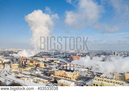 In The Winter City, The Factory's Chimneys Are Smoking. The Concept Of Air Pollution. Environmental
