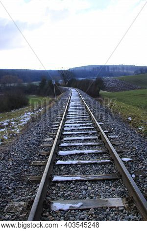 Railway Tracks Run Straight Away From The Viewer