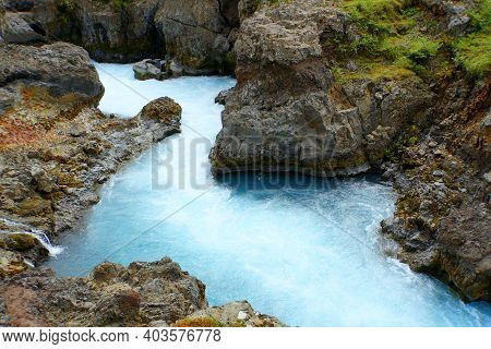 Beautiful Blue River And Rock Formations At Barnafoss Waterfalls In Western Iceland
