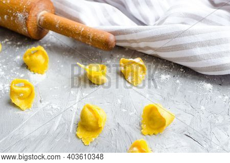 Proccess Of Making Tortellini. Freshly Prepared Homemade Raw Tortellini. Traditional Italian Cuisine