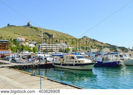 Balaklava, Sevastopol, Crimea, Russia-june 02, 2018: Boats And Boats Moored To The Shore Of Balaklav