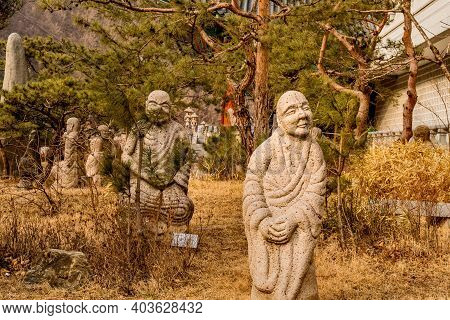 Danyang-gun, South Korea; Jan. 13, 2021: Stone Carved Buddhist Deities In Garden At Guinsa Temple.