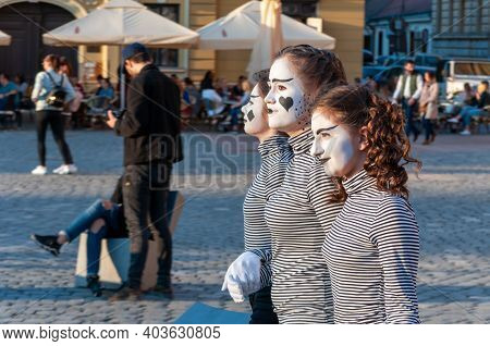 Timisoara, Romania - March 31, 2017: Girls In Mime Costume Walking On The Street At The Checkart Car