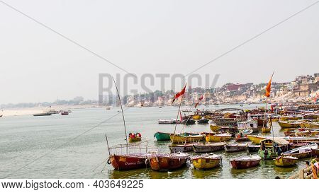Varanasi, India - May 06, 2019 - A View Of Historic Varanasi Ghats, Ancient Temples And Buildings Al