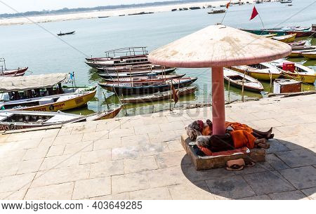 Varanasi, India - May 06, 2019 - A View Of Historic Varanasi Ghats, Ancient Temples And Buildings Al