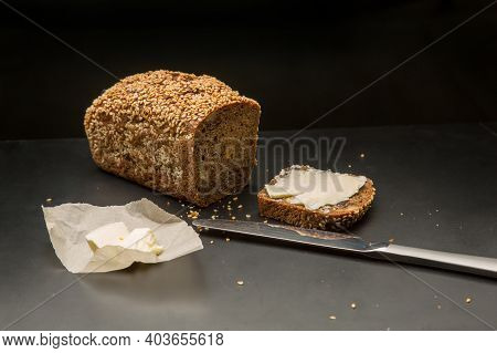 Homemade Square Bread Made From Gluten-free Flour With Sesame Seeds. Piece Of Bread With Butter And 