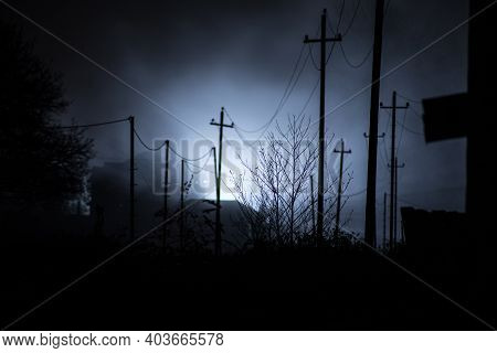 Old House With A Ghost In The Forest At Night Or Abandoned Haunted Horror House In Fog. Old Mystic B