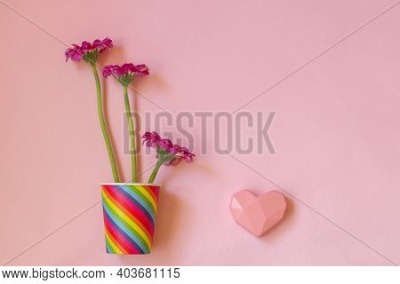 Valentines Day. Paper Cup Rainbow And Gerbera ,heart On Soft Pink Background. The Concept Of Gay Pri