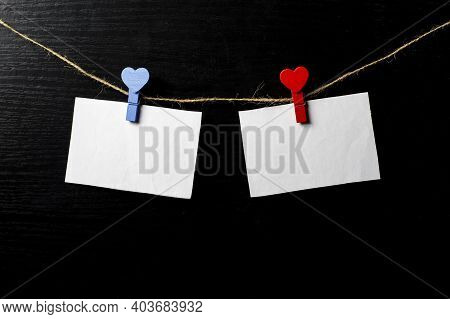 Photos Are Held With Heart-shaped Clothespins On A Rope. Copspace. Valentines Day.