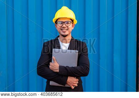 Portrait Of Asian Business Man Import And Export Goods Wear A Helmet Logitics Shipping At Container 