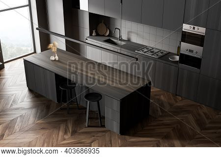 Top View Of Modern Kitchen With Gray And Wooden Walls, Wooden Floor And Grey And Wooden Cupboards. W
