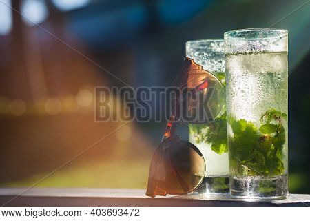 Picture Or Refreshening Mojito Cocktail And Sunglasses. Cuba, Cayo Largo. Caribbean