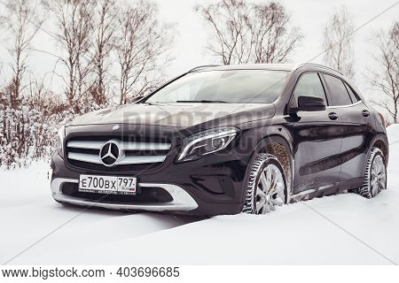 Moscow, Russia-january 10, 2021: A Black Mercedes Benz Gla 250 Luxury Crossover Makes Its Way Throug