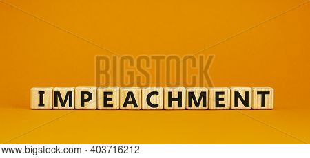 Impeachment Symbol. Wooden Cubes With The Word 'impeachment'. Beautiful Orange Background, Copy Spac