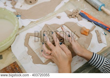 Women's Hands Knead Clay, Drawing Elements Of The Product. Production Of Ceramic Products At The Mas