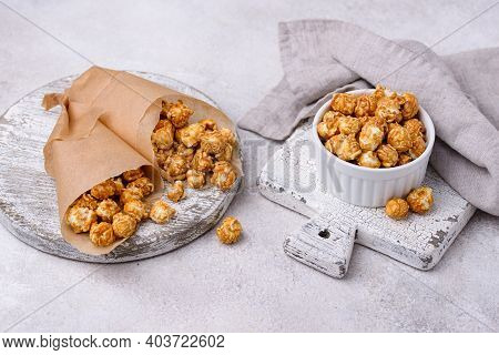 Salted Caramel Popcorn In Bowl On Light Background