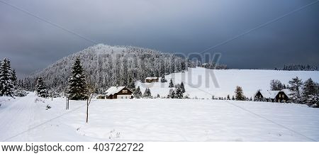Winter In Jizera Mountains. Cloudy Evening In Jizerka Village, Czech Republic