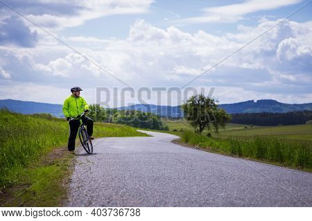 Man Riding Bike, Making Short Break, Enjoying Beautiful Nature. Sport, Healthy Lifestyle And Nature 