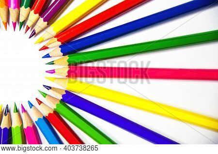 Semi-sircle Of Colored Pencils On White Background