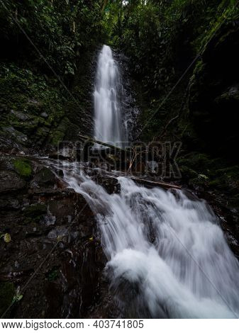 Panorama View Of Cascada De Reina Waterfall In Tropical Rain Cloud Forest Mindo Valley Jungle Nambil