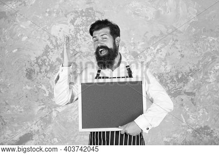 Man Good Looking Hospitable Restaurant Waiter With Blackboard Copy Space, Meal Of The Day Concept.