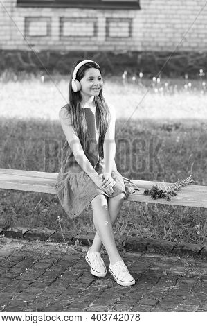 Just Chill. Happy Girl Listen To Music On Park Bench. Chill Vibes. Chill Out. Relax And Enjoy The Mo
