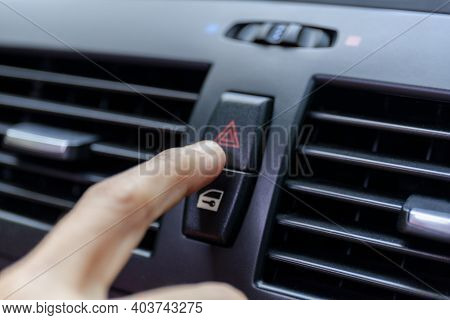 Close Up Hand Press The Emergency Light In The Car, Fingers Press Button.for Open The Contract Emerg