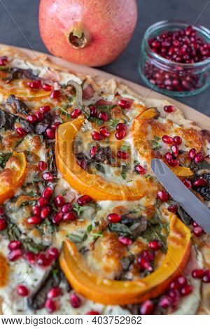 Tarte Flambee With Pumpkin, Cheese, Kale And Pomegranate