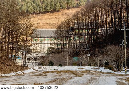 Danyang-gun, South Korea; Jan. 13, 2021: Winter Landscape Of Road To Guinsa Temple In Background.