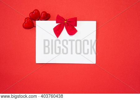 Valentines Day Congratulation. Red Rose And Greeting Card With Heart Sign On Black Background Top Vi