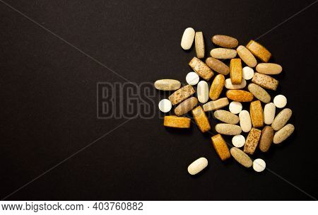 Glutamine And Bcaa Amino Acids. Nutrition For Bodybuilding. Fitness Supplements On Black Stone Backg