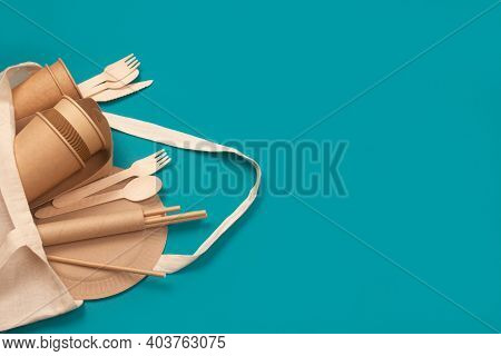 Set Of Eco-friendly Tableware - Kraft Paper Food Cups And Containers In Cotton Bag On Green Backgrou