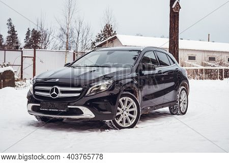 MOSCOW, RUSSIA-JANUARY 10, 2021: Black luxury crossover Mercedes Benz GLA 250 on a suburban plot in