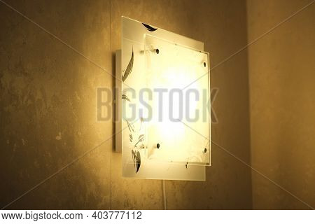 Square Duplex Ornate Lamp In The Dark. Sconce With Elegant Floral Pattern On  Wall Background With C