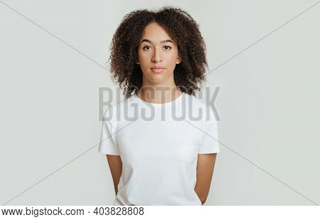 Serious, Calm, Strict Emotions. Emotionless, Unemotionally Young African American Woman With Curly H