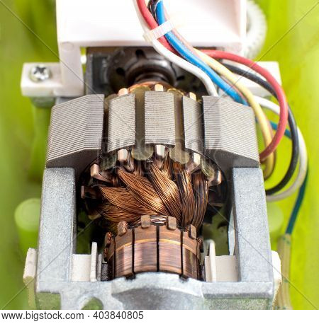 Broken Electric Motor In A Household Appliance Hand Mixer. Malfunction Of The Rotor And Stator Of El