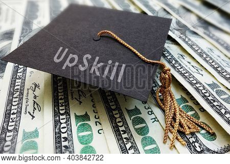 Mini Graduation Cap With Upskill Text On Money