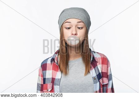 Smiling Teen Girl Blowing Bubblegum Winking At You