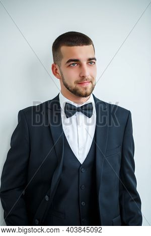 Stylish Successful Male Businessman In A Black Jacket And With A Bow Tie