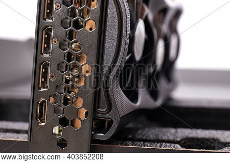 New high end graphics card computer hardware upgrade on a desk. Serious GPU cooling for high power card