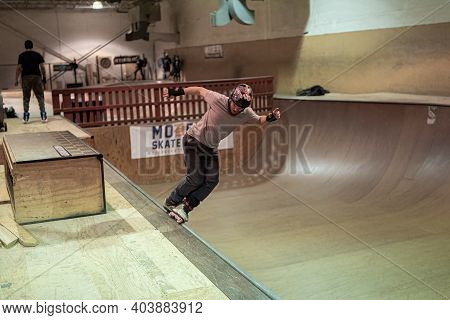 Detroit, Michigan - Usa - January 13 -2021: Skaters Practice Tricks At An Indoor Skate Park During O