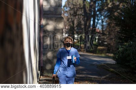 Woman Caregiver, Nurse Or Healthcare Worker Outdoors On The Way To Work, Coronavirus Concept.