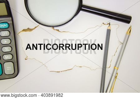 Anticorruption Text Is Written On A White Sheet Of Paper Which Lies On A White Background Near The M