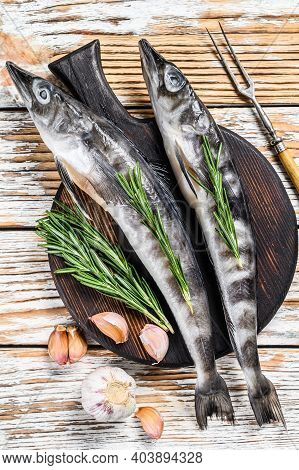 Raw Whole Icefish With Herbs. White Wooden Background. Top View
