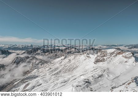 Snowy White Alpine Mountain Range In Summer Time On Zugspitze, Top Of Germany