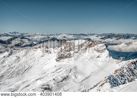 Snowy White Alpine Mountain Range In Summer Time On Zugspitze, Top Of Germany