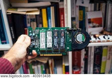 Paris, Frnace - 2019: Male Hand Holding New Dell Ultra Speed Drive Quad Nvme M2 Disk With Multiple N