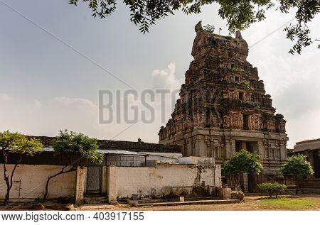 Hampi, Karnataka, India - November 5, 2013: Malyavanta Raghunatha Temple. Brown Stone Sculpted Gopur