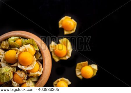Cape Gooseberry Or Physalis Minima On Wood Background. Tropical Fruit And Food For Health Concept.